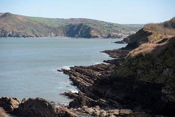 A view from the cliffs to Wild Pear Beach and Coombe Martin.