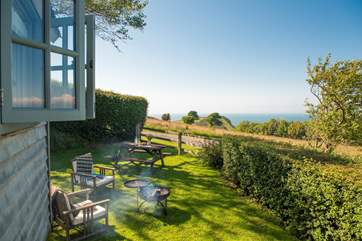 Cook up something scrummy on the fire-pit barbecue.