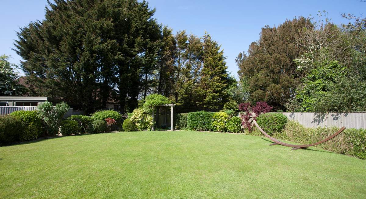 The beautiful secluded garden to the rear of the property is a lovely outdoor space in which to enjoy the sunshine.