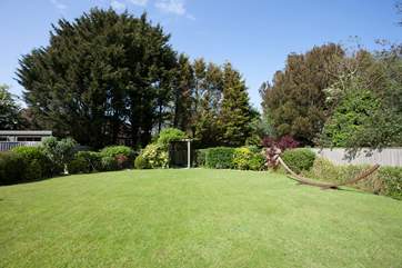The beautiful secluded garden to the rear of the property is a lovely outdoor space in which to enjoy the sunshine.