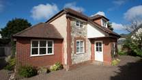 There is plenty of private parking here at The New House. The windows and front door are now grey.  