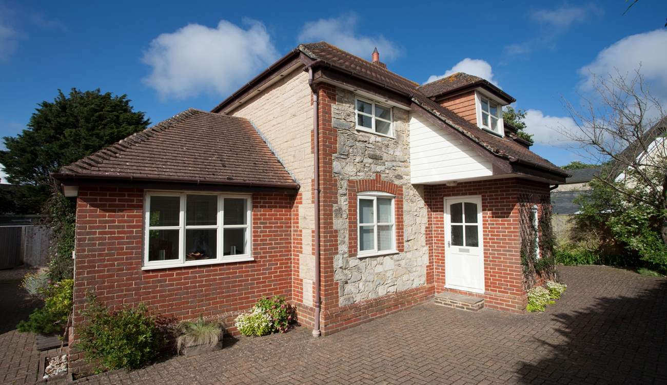 There is plenty of private parking here at The New House. The windows and front door are now grey.  