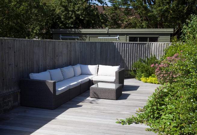 As the sunshine fills the garden, relax on one of many seating options outside.