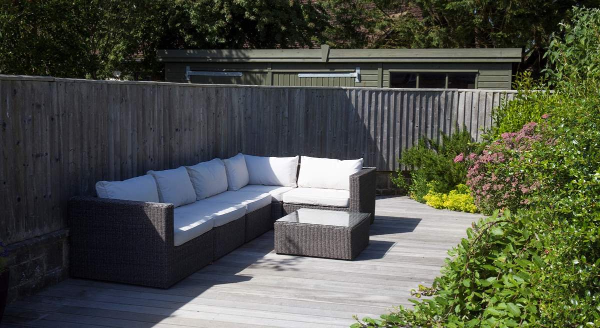 As the sunshine fills the garden, relax on one of many seating options outside.