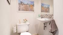 The ground floor utility-room with WC and wash basin. 
