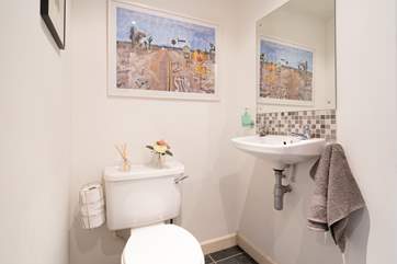 The ground floor utility-room with WC and wash basin.