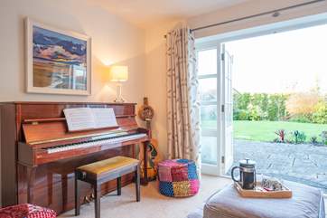 The sun-room leads out to the stunning garden.