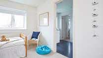 The children's bedroom leading through to the shared bathroom.