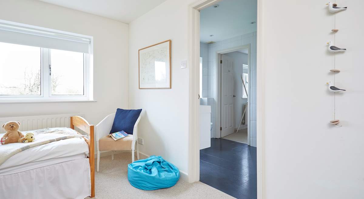 The children's bedroom leading through to the shared bathroom.