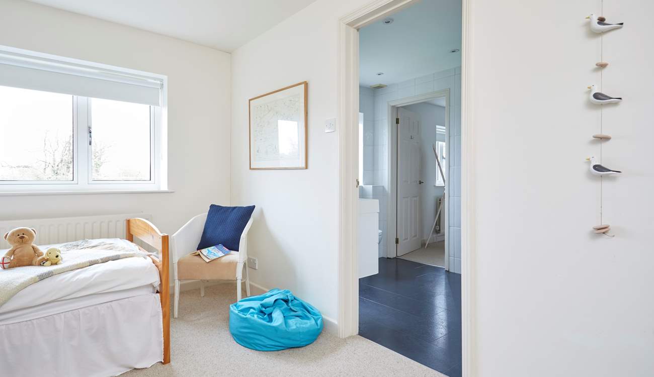 The children's bedroom leading through to the shared bathroom.