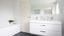 The large shared bathroom to the king-size double bedroom and bunk bedroom.