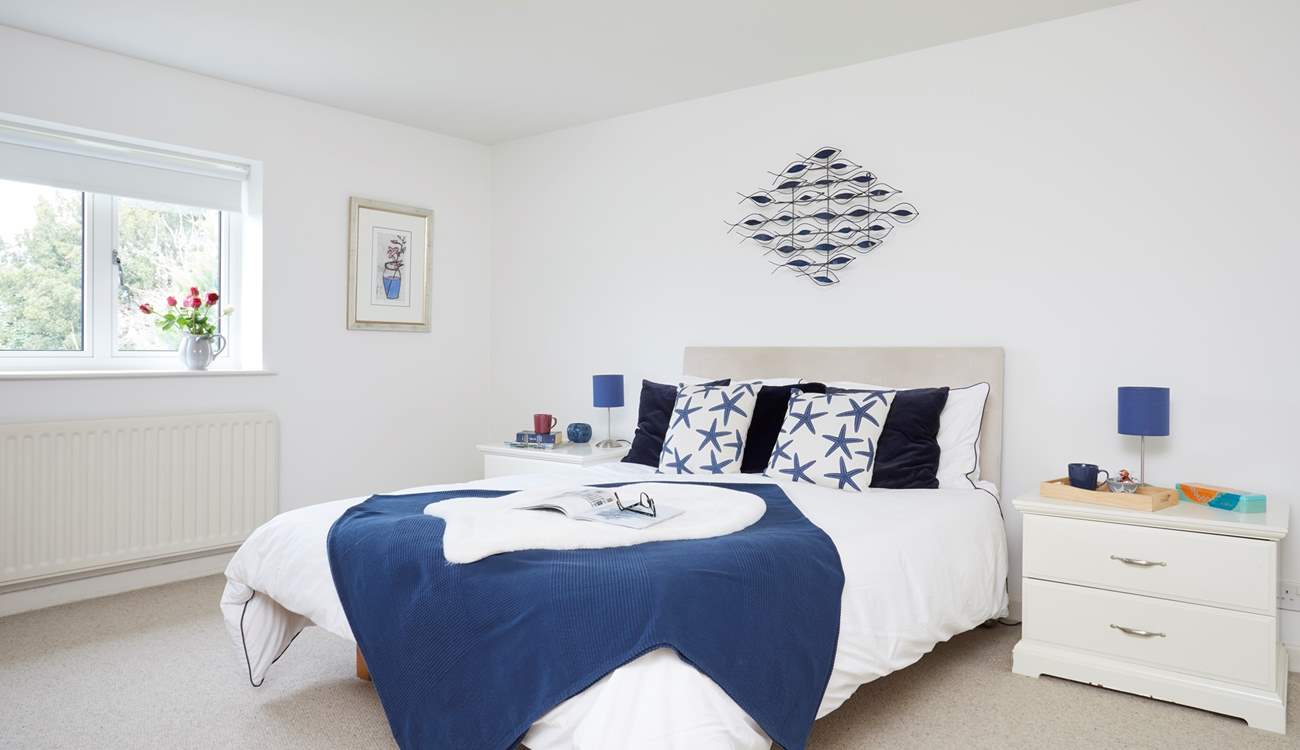 The king-size double bedroom, with access to the shared bathroom.