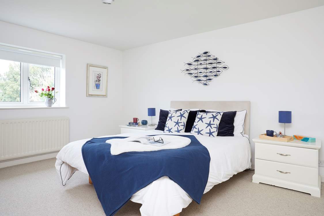 The king-size double bedroom, with access to the shared bathroom.
