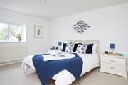 The king-size double bedroom, with access to the shared bathroom.