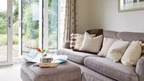 Relax on the deep sofa with plenty of scatter cushions, plan your day ahead with the local map.