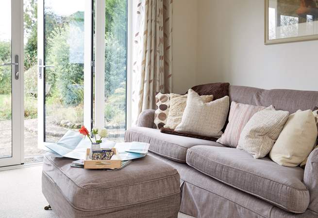 Relax on the deep sofa with plenty of scatter cushions, plan your day ahead with the local map.