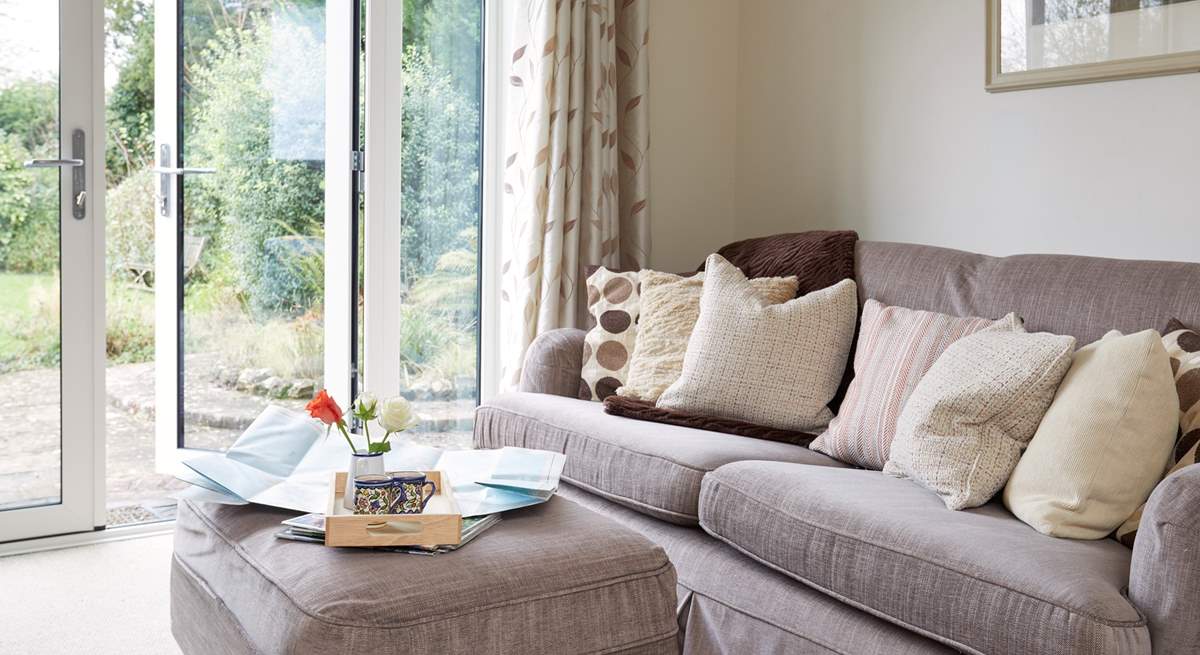 Relax on the deep sofa with plenty of scatter cushions, plan your day ahead with the local map.