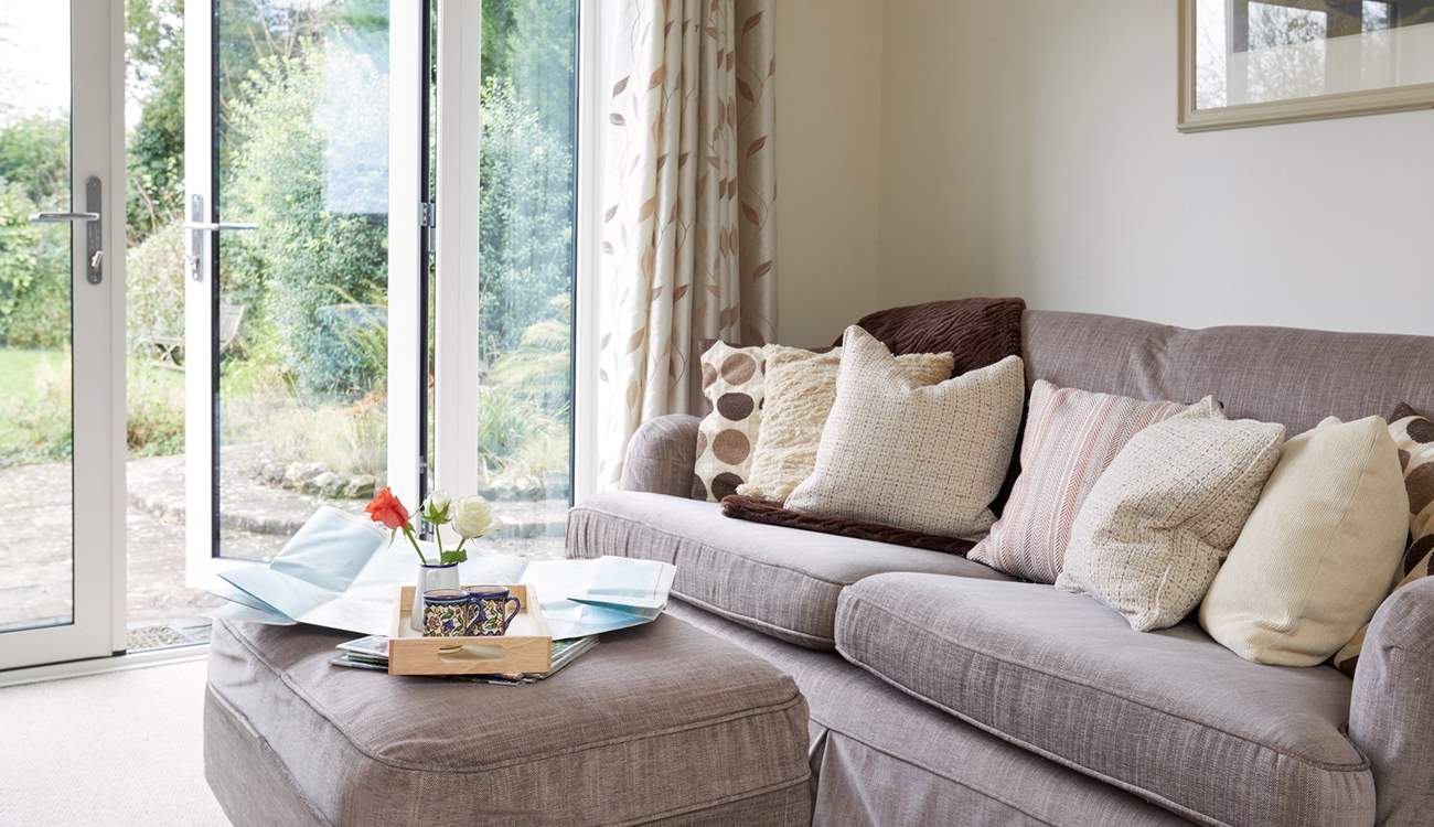 Relax on the deep sofa with plenty of scatter cushions, plan your day ahead with the local map.