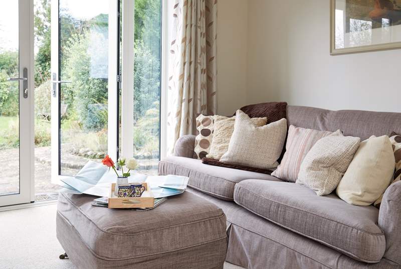 Relax on the deep sofa with plenty of scatter cushions, plan your day ahead with the local map.