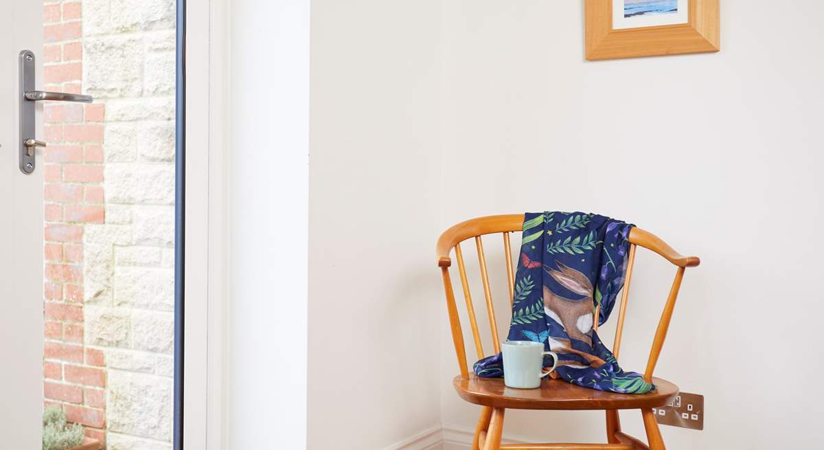 The corner chair in the dining area is a great seat to observe the activities around the  table.