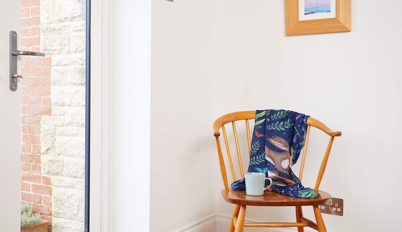 The corner chair in the dining area is a great seat to observe the activities around the  table.