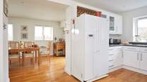 The spacious kitchen/dining-room is the ideal place for a social atmosphere.