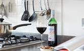 Enjoy a glass of red while preparing a local recipe. - Thumbnail Image