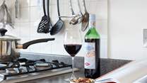 Enjoy a glass of red while preparing a local recipe.