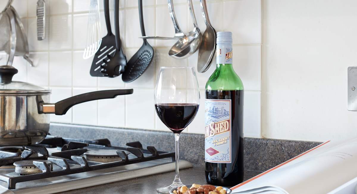 Enjoy a glass of red while preparing a local recipe.