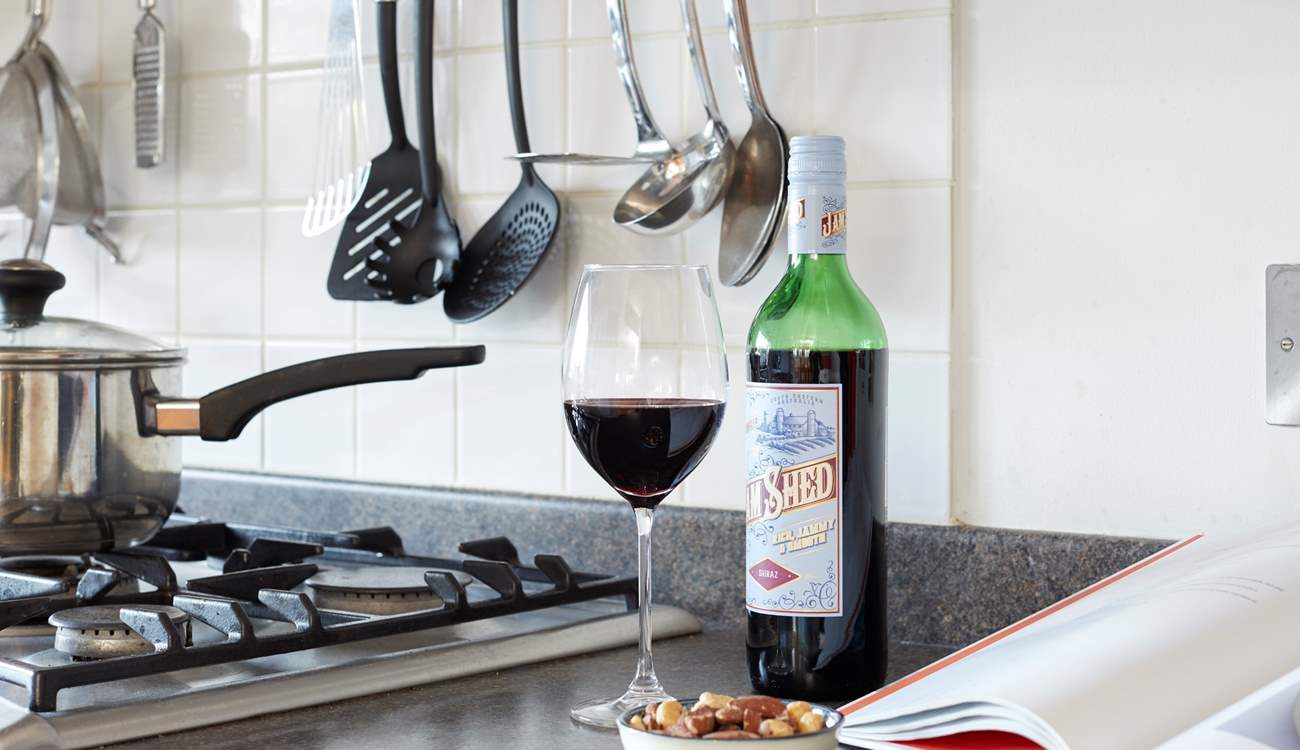 Enjoy a glass of red while preparing a local recipe.