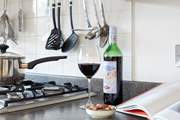 Enjoy a glass of red while preparing a local recipe.