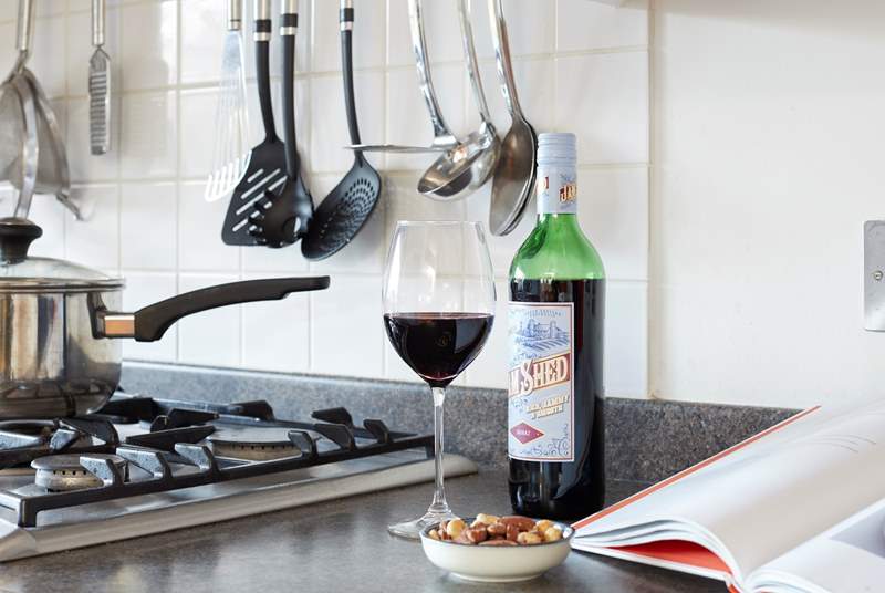 Enjoy a glass of red while preparing a local recipe.