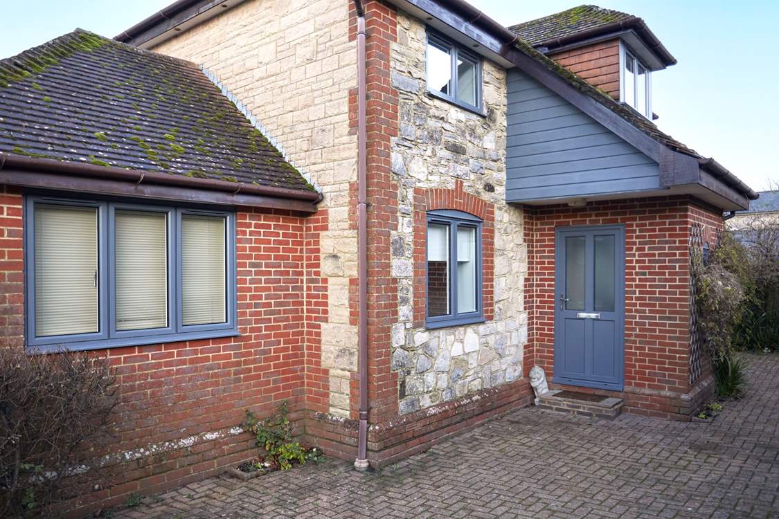 Welcome to the New House with the recently replaced front door and windows in grey. More exterior photos to come in 2024.