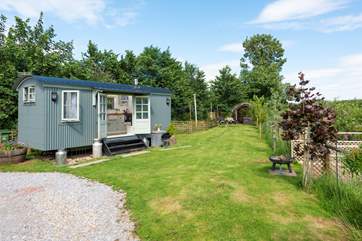 From the steps of the hut you have countryside views, with the hot tub down at the far end of the garden in a sheltered position.
