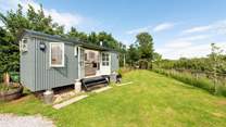 Welcome to Duck's Puddle Shepherd's Hut, with the hot tub down at the far end of the garden in a sheltered position.