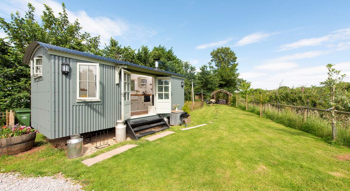 Welcome to Duck's Puddle Shepherd's Hut, with the hot tub down at the far end of the garden in a sheltered position.