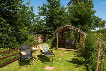There is so much outside space here - at the far end of the garden you will find the hot tub, as well as the perfect spot for the sun loungers.