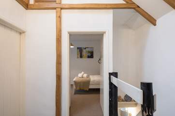 This lovely landing area unites all the bedrooms. Peeking into bedroom 2.