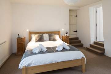 There are 3 steps down into the master bedroom from the landing, and then 3 steps up into the large en suite.