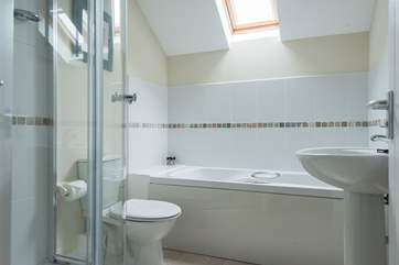 The en suite has both a bath and shower cubicle.