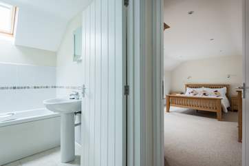 The large master bedroom with en suite bathroom.