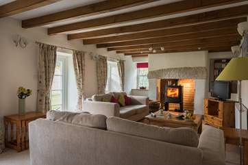 The cosy sitting-room is in the original part of the cottage.