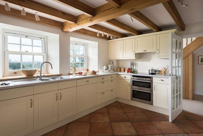 The large kitchen offers an electric hob and electric oven, or the use of a handsome range cooker.