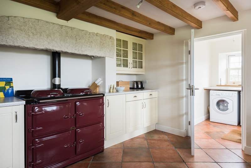 The kitchen boasts a range cooker and separate utility-room by the back door, which leads out to the garden.