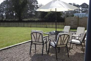 Relax in the sunshine in the private garden.