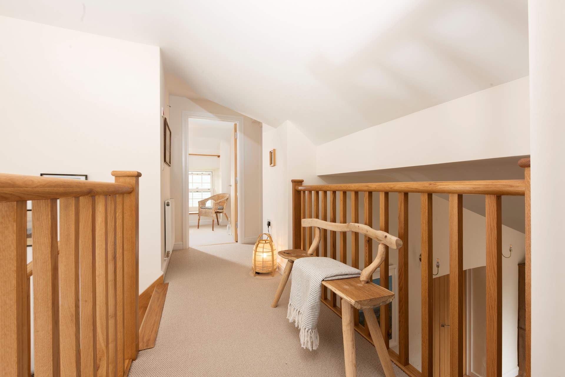 The first floor landing has a mezzanine design.