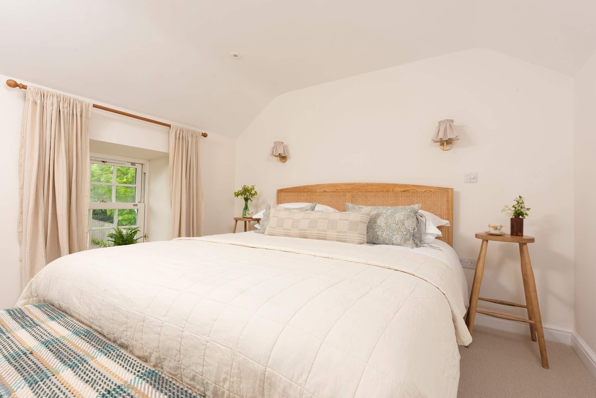 The principal bedroom is dressed in luxury linens.