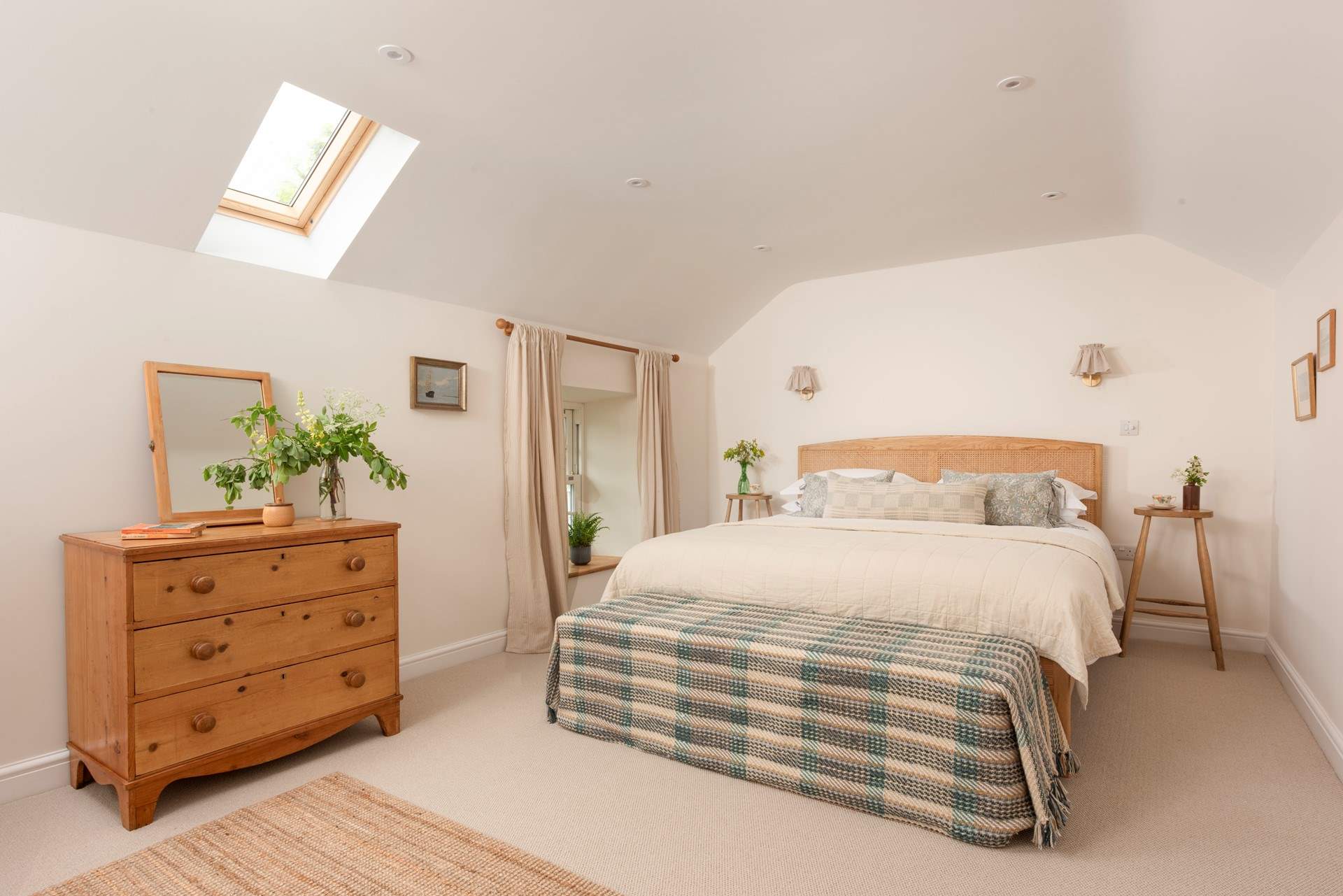The principal bedroom has bespoke soft furnishings and luxury linens.