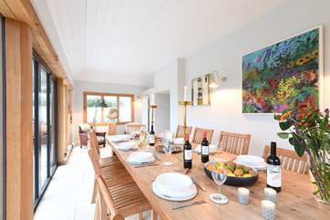 Plenty of room for everyone around the large dining-table.