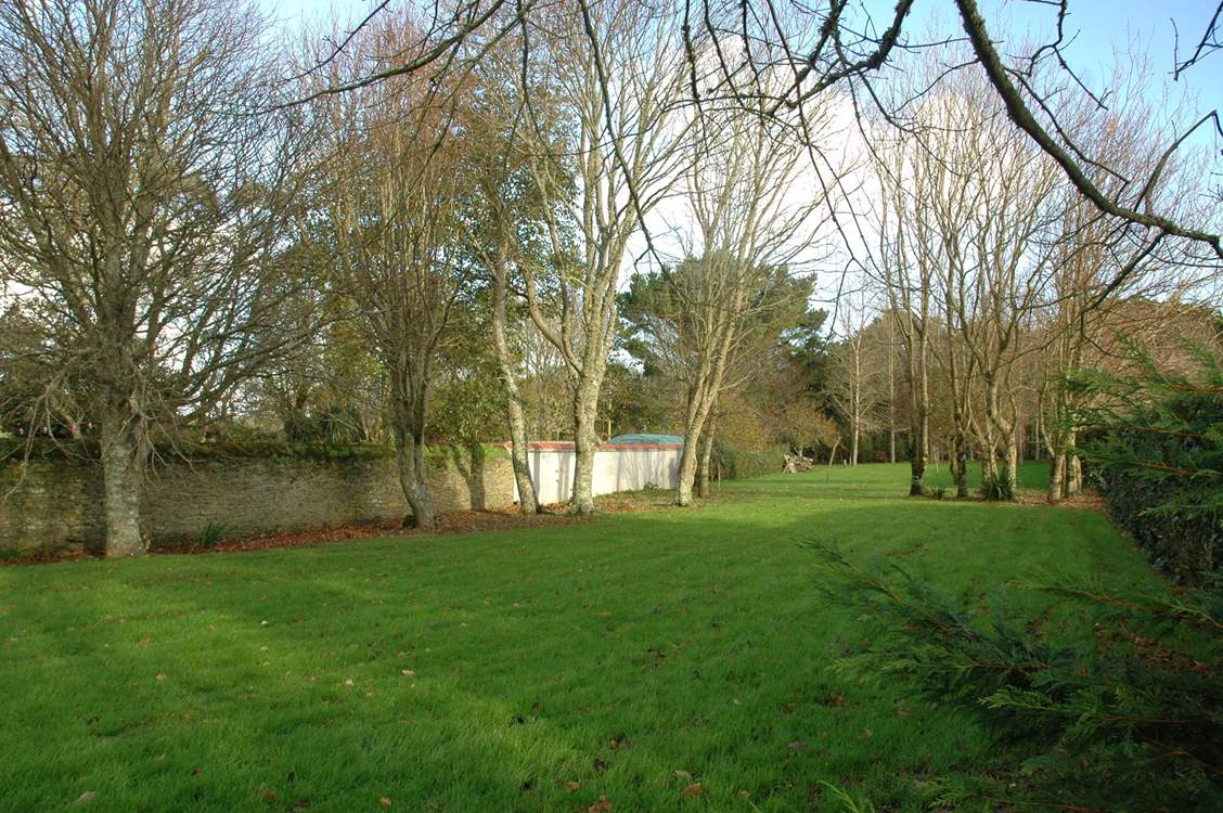 The large garden is fully enclosed.